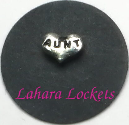 This floating charm is a silver heart that has aunt inscribed on it.