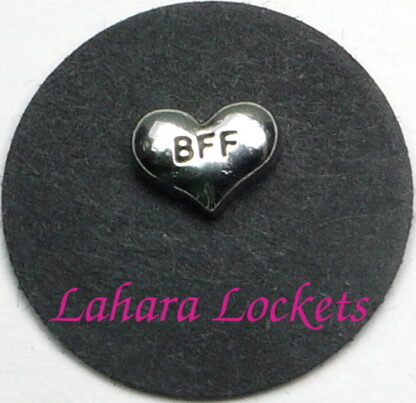 This floating charm is a silver heart that says bff.