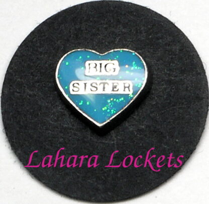 This floating charm is a blue heart that says big sister.