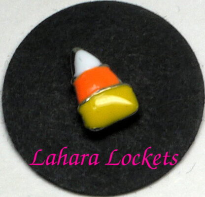 This floating charm is a piece of white, orange and yellow candy corn.