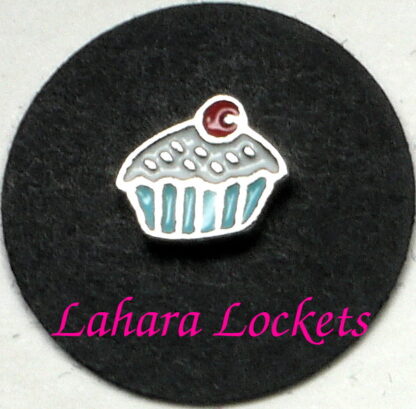 This floating charm is a cupcake with blue liner, white frosting and red cherry on top.