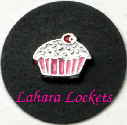 This floating charm is a cupcake with pink liner, white frosting and red cherry on top.