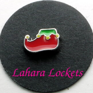 This floating charm is a red, elf shoe with green trim and yellow bells.