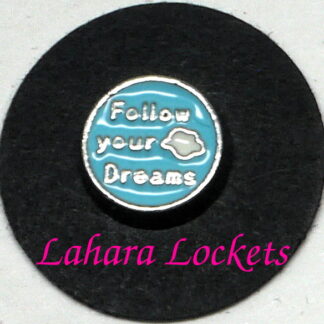 This floating charm is a blue cirle that says follow your dreams in silver with a white cloud accent.