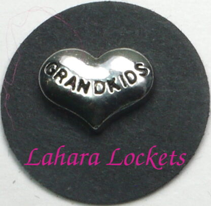 This floating charm is a silver, heart inscribed with the word grandkids.