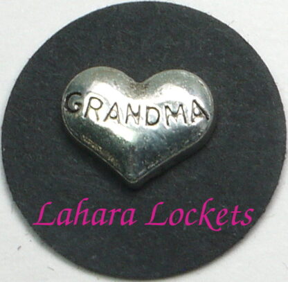 This floating charm is a silver heart inscribed with the word grandma.