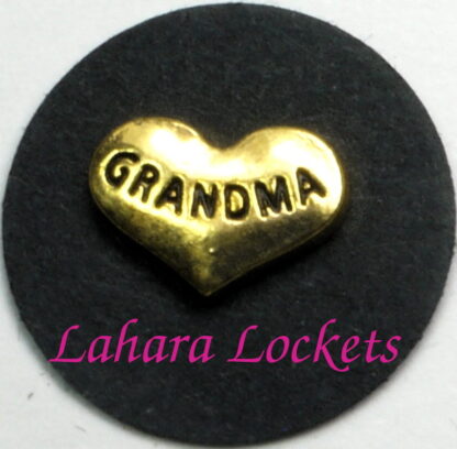 This floating charm is a gold heart inscribed with the word grandma.