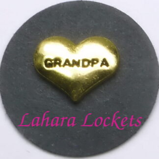 This floating charm is a gold heart inscribed with the word grandpa.