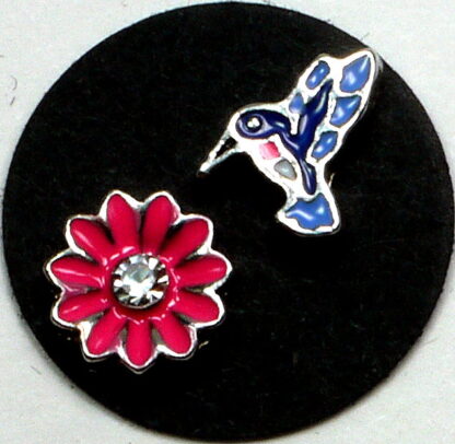 These floating charms are of a blue hummingbird hovering over a bright pink flower.