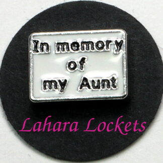 This floating charm is a white rectangle that says "in memory of my Aunt" in black letters.