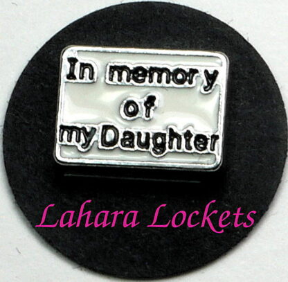 This floating charm is a white rectangel that says in memory of my daughter in black letters.