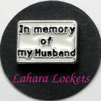This floating charm is a white rectangle that says in memory of my husband in black letters.
