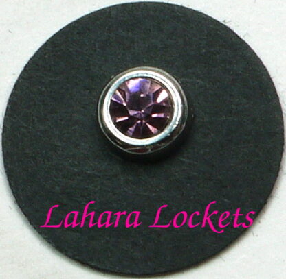 This round floating charm is silver with a pink, June birthstone.