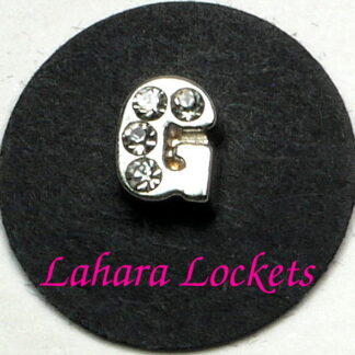 This floating charm is a silver letter G with clear gems.