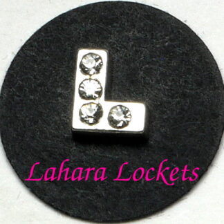 This floating charm is a silver L with clear gems.