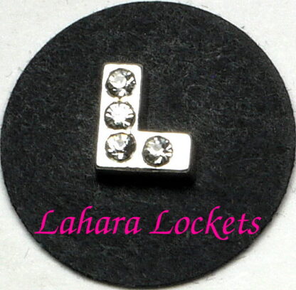 This floating charm is a silver L with clear gems.