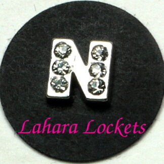 This floating charm is a silver letter N with clear gems.