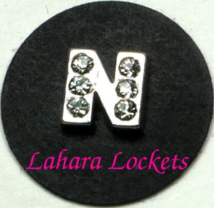 This floating charm is a silver letter N with clear gems.