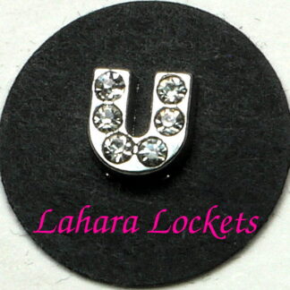 This floating charm is a silver letter U with clear gems.