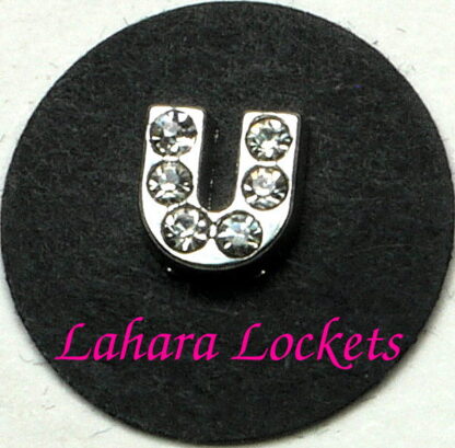 This floating charm is a silver letter U with clear gems.