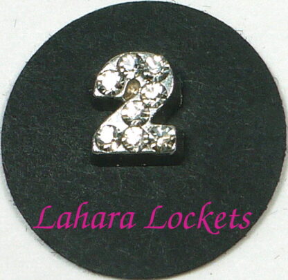 This floating charm is a silver, number two with clear gems.