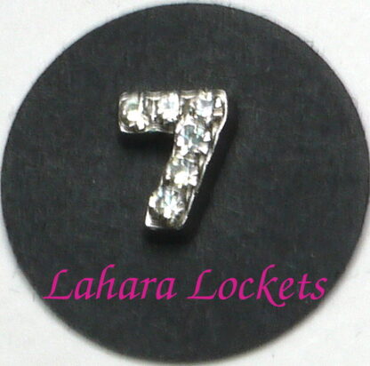 This floating charm is a silver, number seven with clear gems.