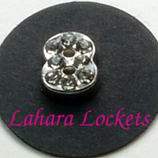 This floating charm is a silver, number eight with clear gems.