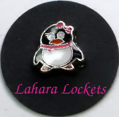 This floating charm is of a penguin with a pink scarf and bow.