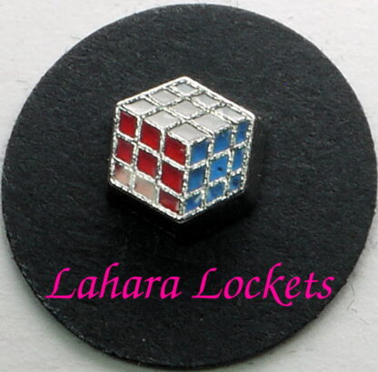 This floating charm is a cube with red, blue and white sides similar to a Rubic's cube.