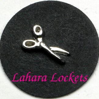 This floating charm is a pair of silver scissors.