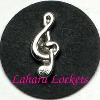 This floating charm is a silver, treble clef with a gem accent at the bottom.