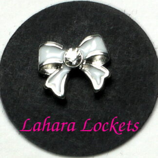 This floating charm is a white bow with a clear gem in the center.