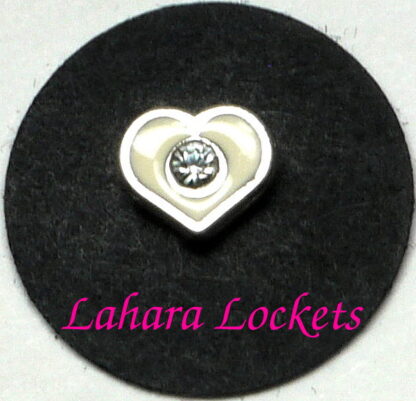 This floating charm is a white heart with a single, clear gem in the center.