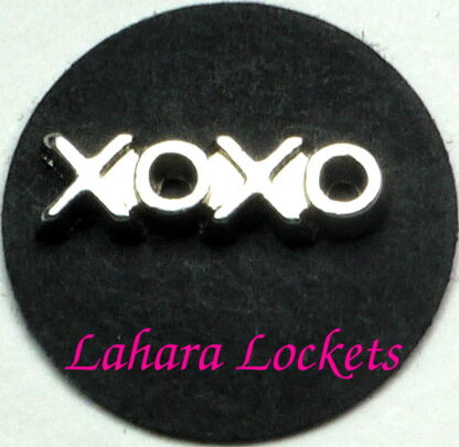 This floating charm says xoxo in silver and means hugs and kisses.